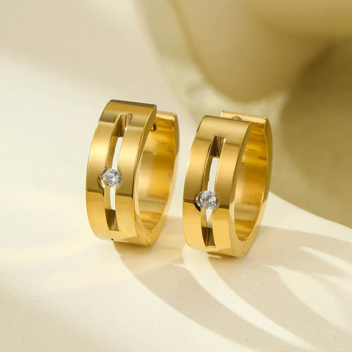 Women's geometric stainless steel drop earrings with 18K gold electroplating in golden finish