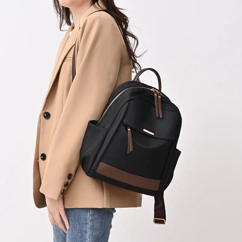 Women's lightweight nylon travel backpack in milk tea colour with large-capacity main compartment