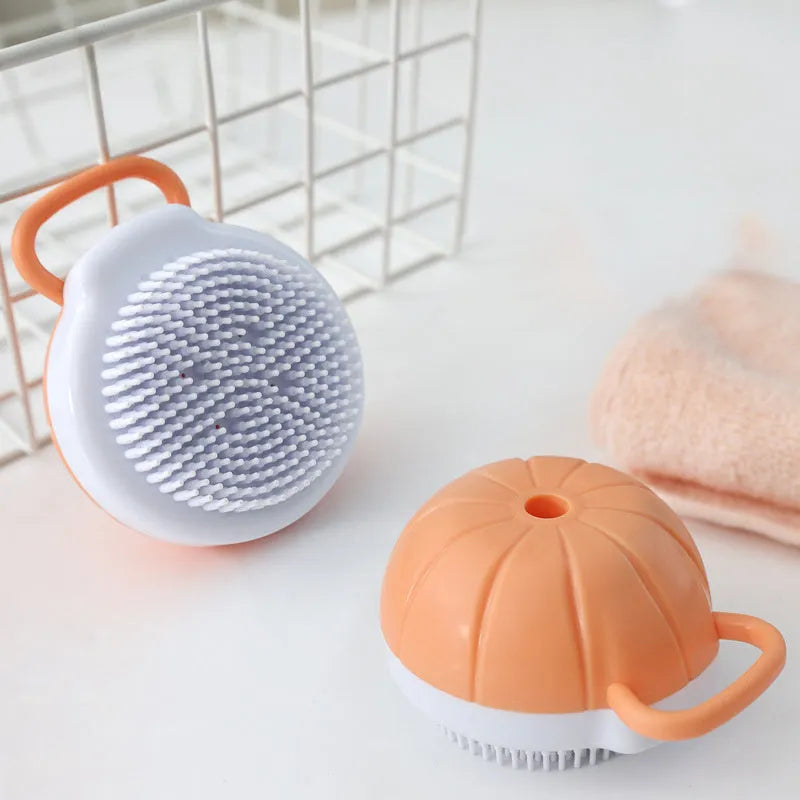 Orange TPR dog bath brush with shampoo dispenser and pumpkin-shaped grip for pet grooming
