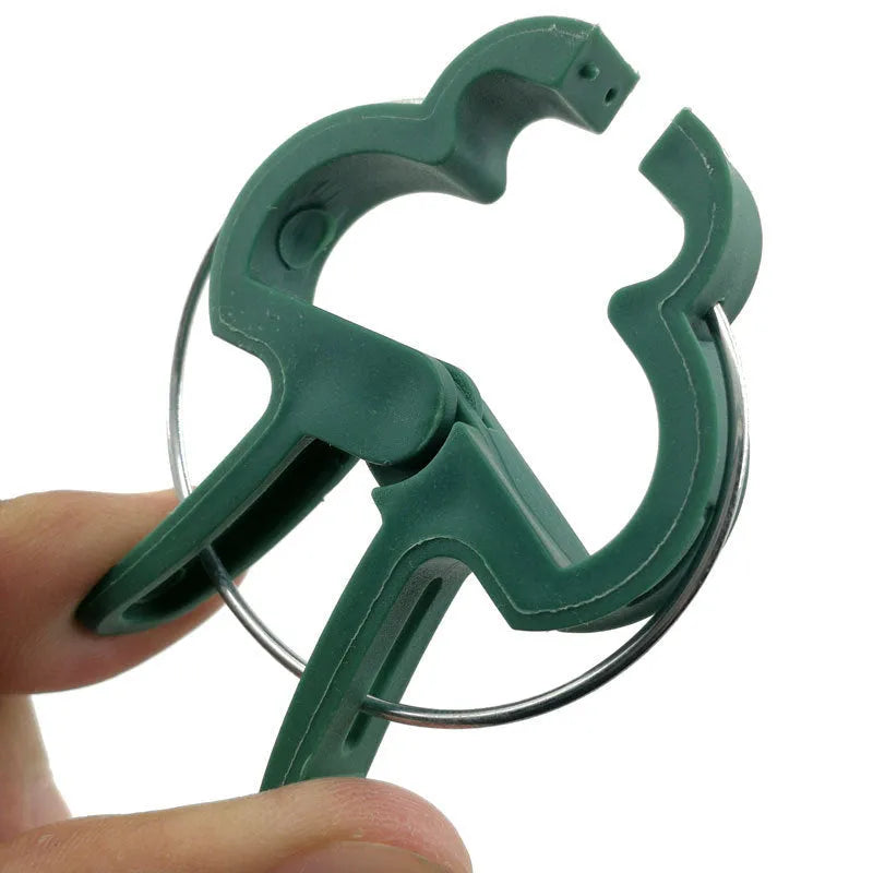 Green plastic and zinc plant fixing clips for tomatoes and climbing vines, showing large and small sizes