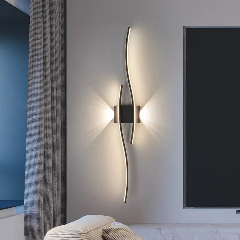 Black 60cm bedside wall lamp with acrylic panel and wrought iron frame on neutral wall