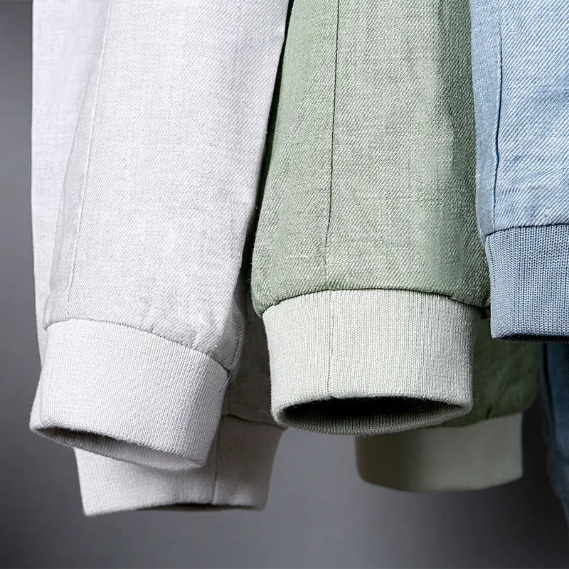 Men's lightweight blue linen jacket with a regular fit, hanging on a hanger.