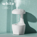 Portable white anti gravity USB cool mist humidifier with 800ml tank and droplet effect on a desk