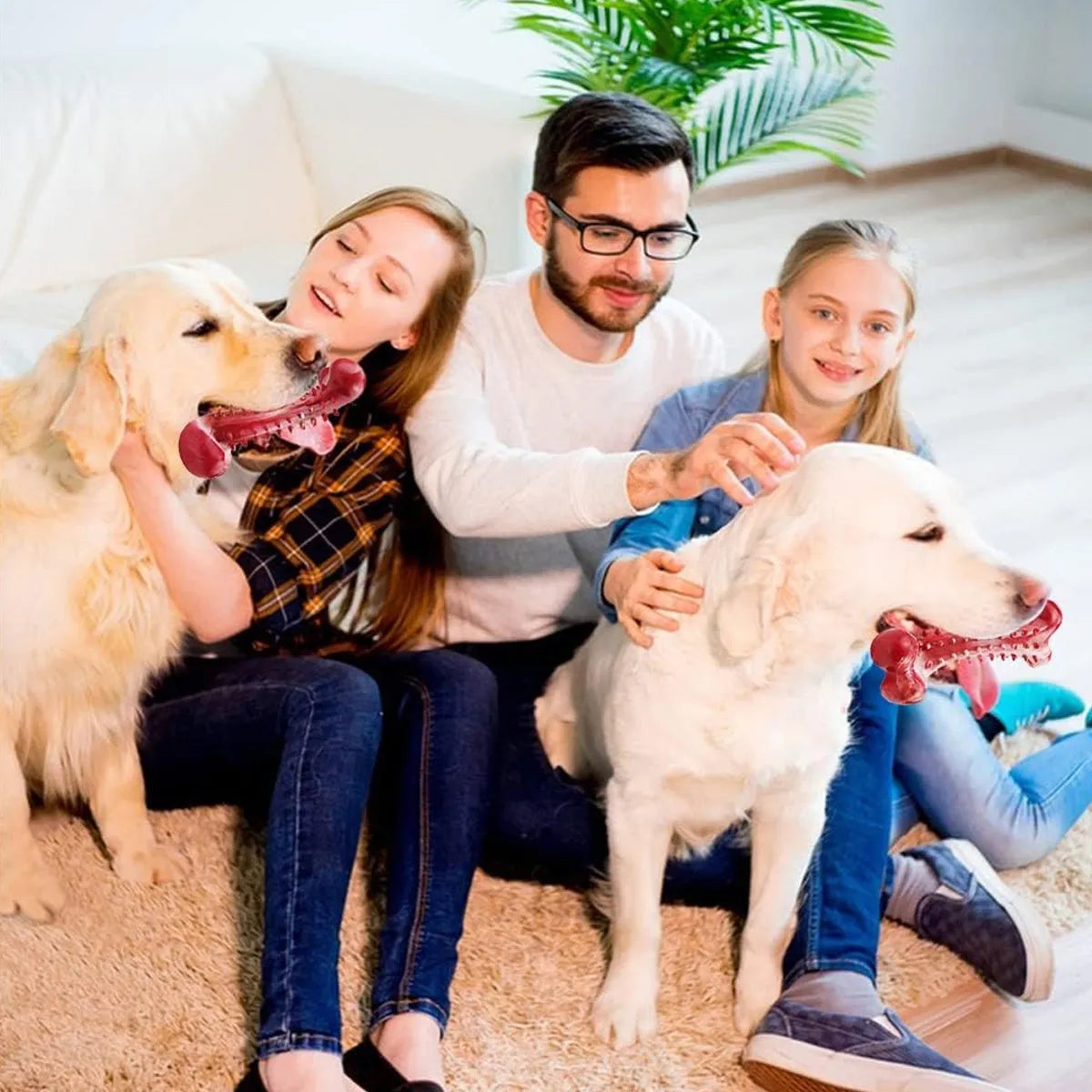 Red natural rubber chew toy for dogs, showing textured surface and solid construction.