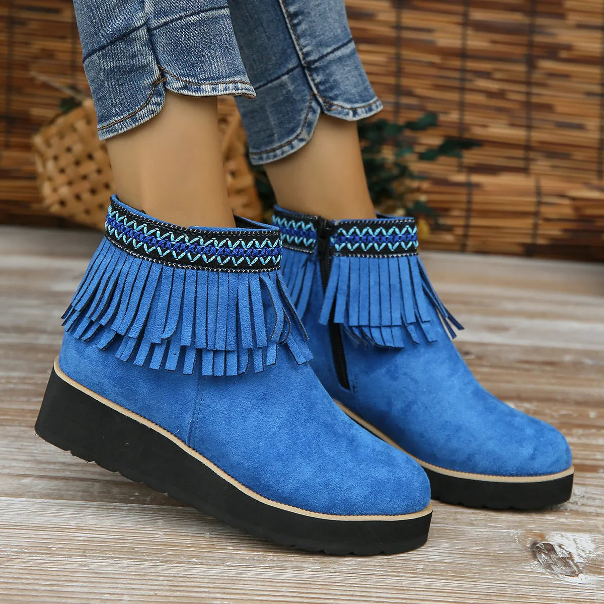 Women's suede wedge ankle boot with thick rubber sole and side zip in black, blue, or dark brown