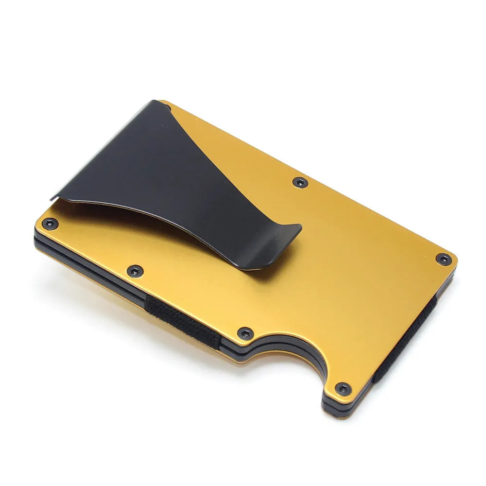 Slim black carbon fibre card holder wallet with geometric design on a desk.