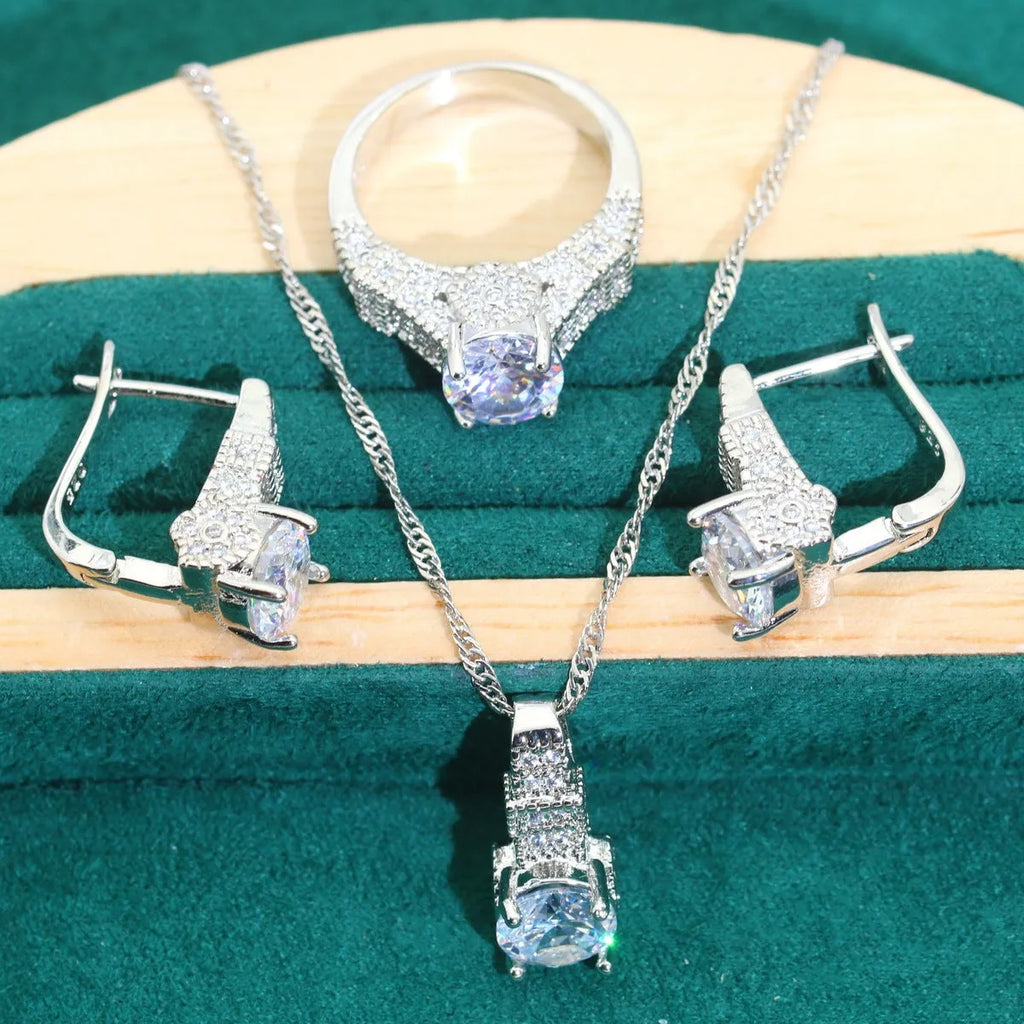 Bridal zircon jewellery four-piece set showing necklace, bracelet, earrings and ring with water wave chain