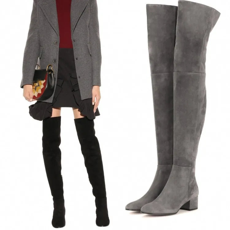 Grey women's suede over-the-knee boots with a flat thick heel and pointed toe.