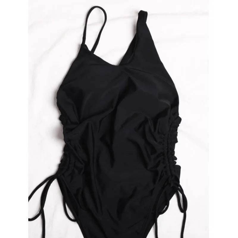 Black women's sleeveless dress with sloping shoulders and tight-fitting bodycon style