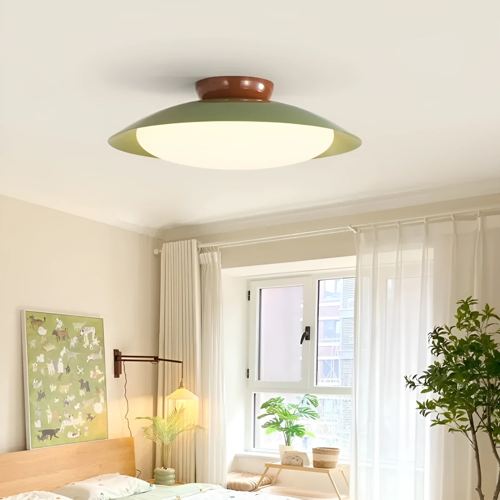 Modern minimalist cream style flying saucer ceiling lamp in a neutral colour on a ceiling.
