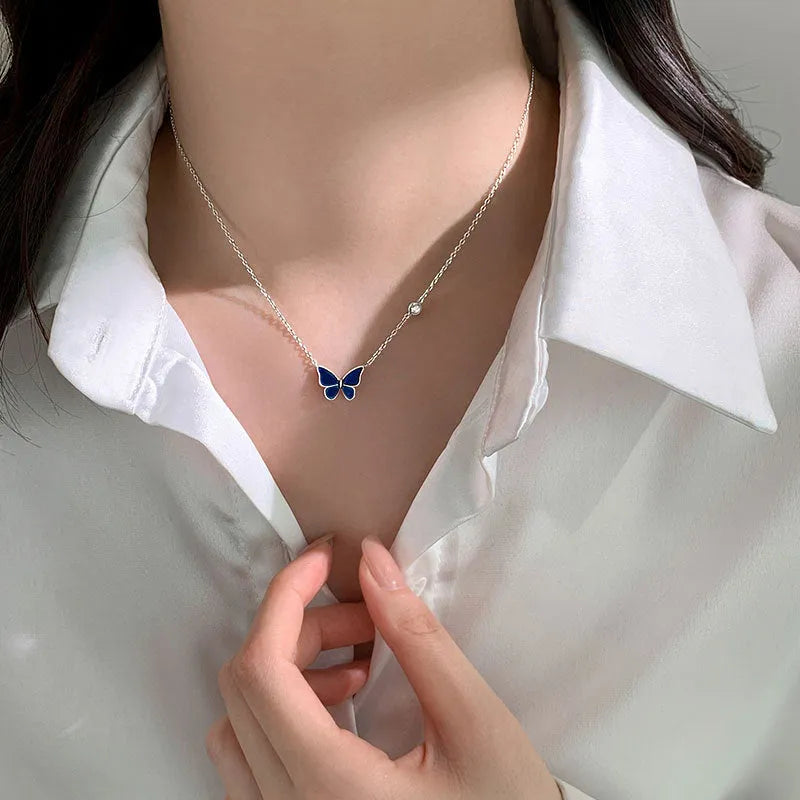 S925 silver butterfly necklace with white silver colour-change pendant on display