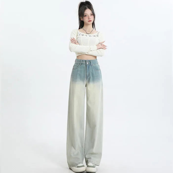 Gradient blue straight-leg women's jeans on a neutral background showing the colour transition.