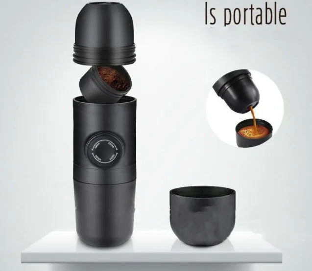 Black portable manual coffee machine showing compact size and manual operation components.
