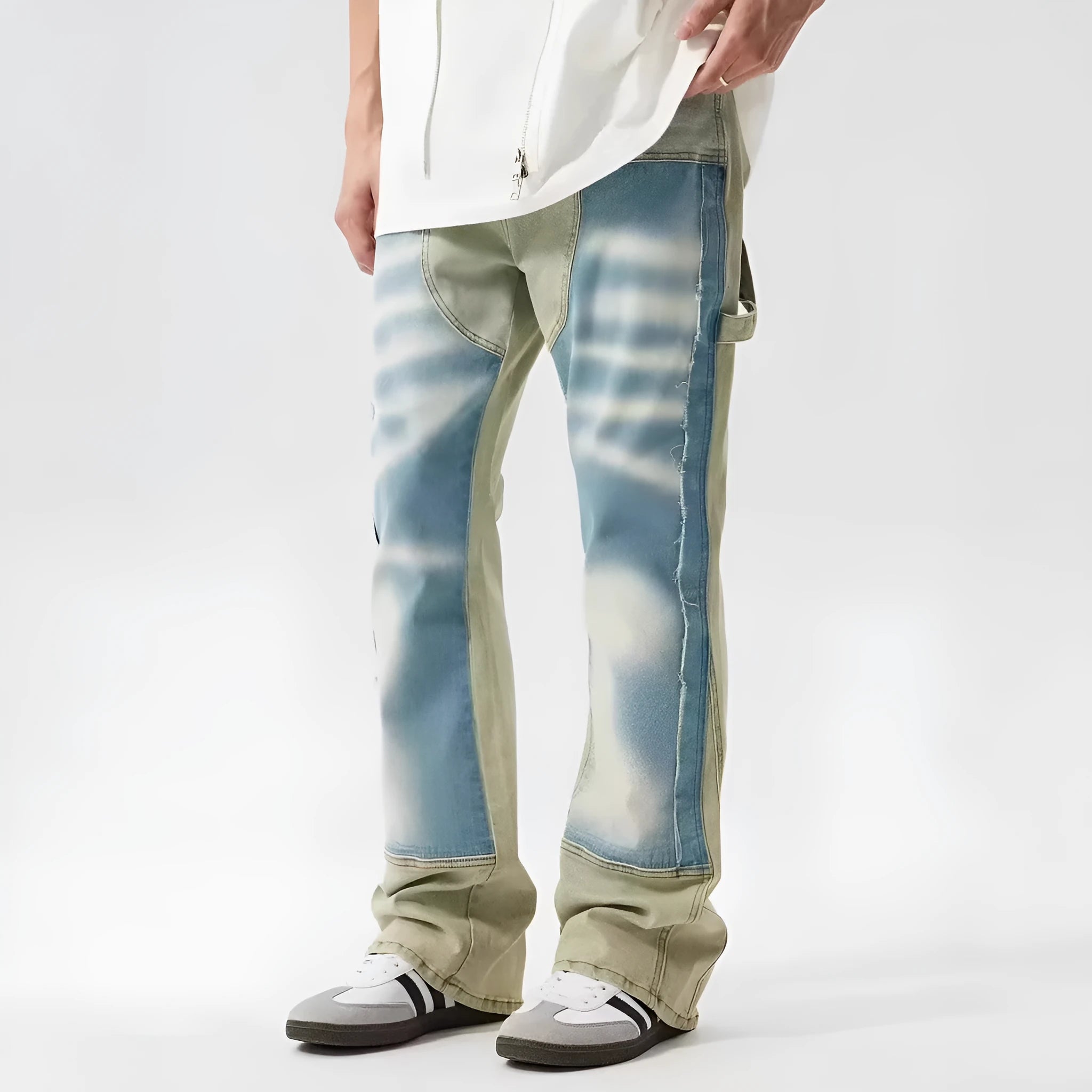 Retro yellow and blue patchwork jeans with splash-ink damaged design on denim fabric
