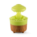 Wood grain white cloud-shaped humidifier diffuser with LED lights and water drop rain effect on a table.