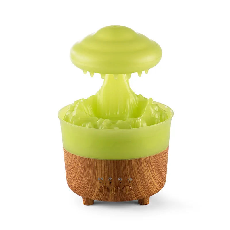 Wood grain white cloud-shaped humidifier diffuser with LED lights and water drop rain effect on a table.