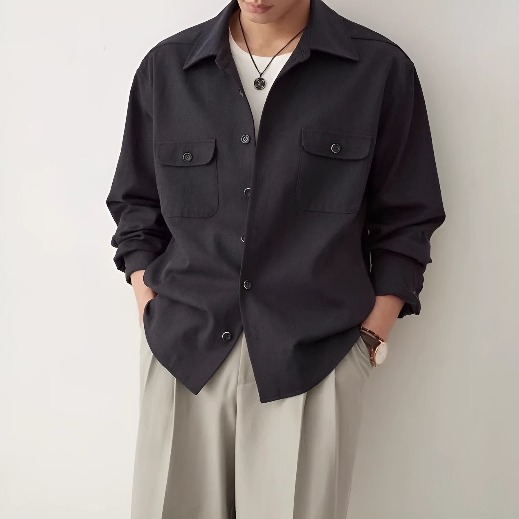 Men's simple lapel casual shirt in light sand rice colour, showing long sleeves and front button placket.