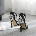 Black suede women's high heel shoes with rhinestone detail and open toe design