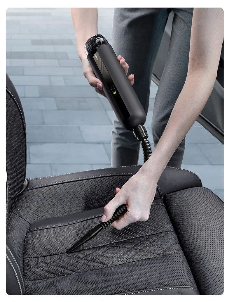 Baseus wireless handheld car vacuum cleaner in black, white, or green with blowing hose accessory.