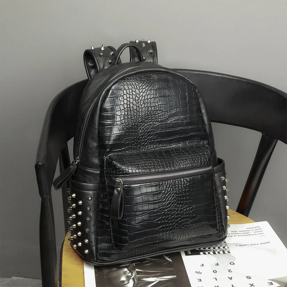 Black waterproof computer schoolbag with oil wax leather features and rivet detailing