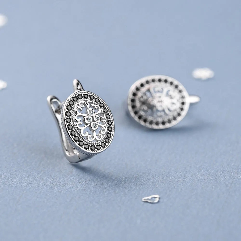 Diamond-encrusted round small ear clip earrings for women copper plated platinum finish geometric shape
