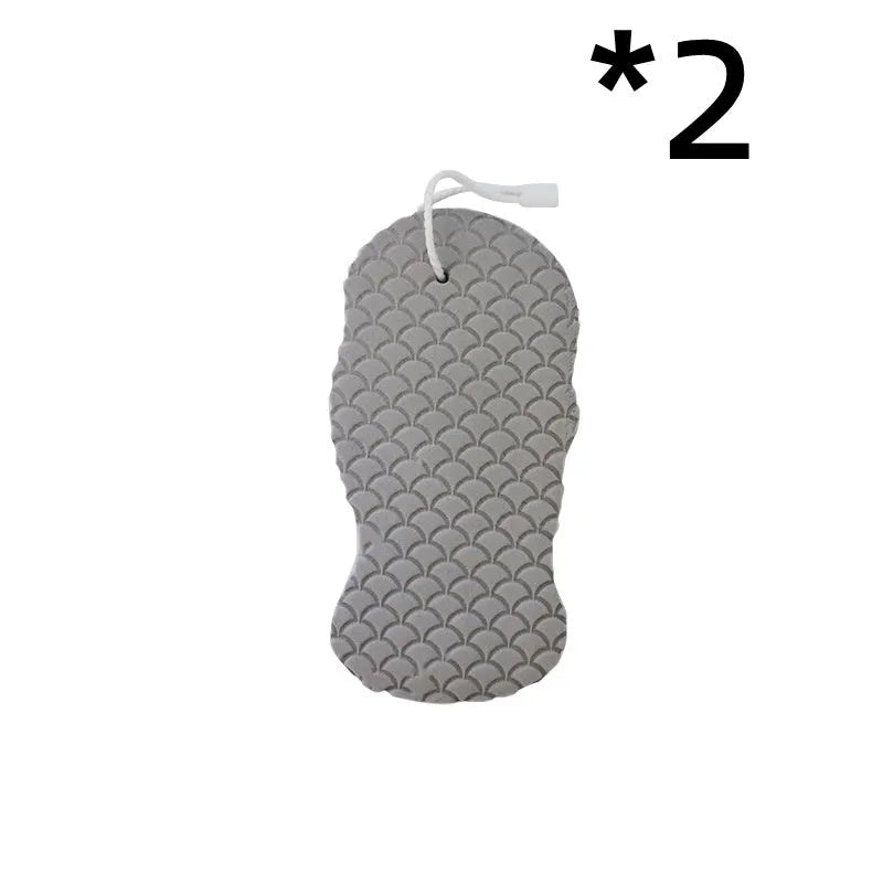White 3D bath sponge with fish scale pattern for gentle body exfoliation in shower.