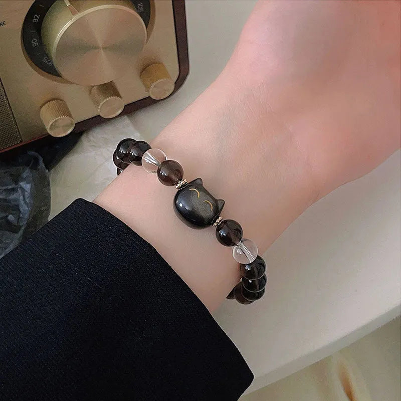 Women's cat head charm bracelet with 8mm Ice Stone on natural silver stone setting.