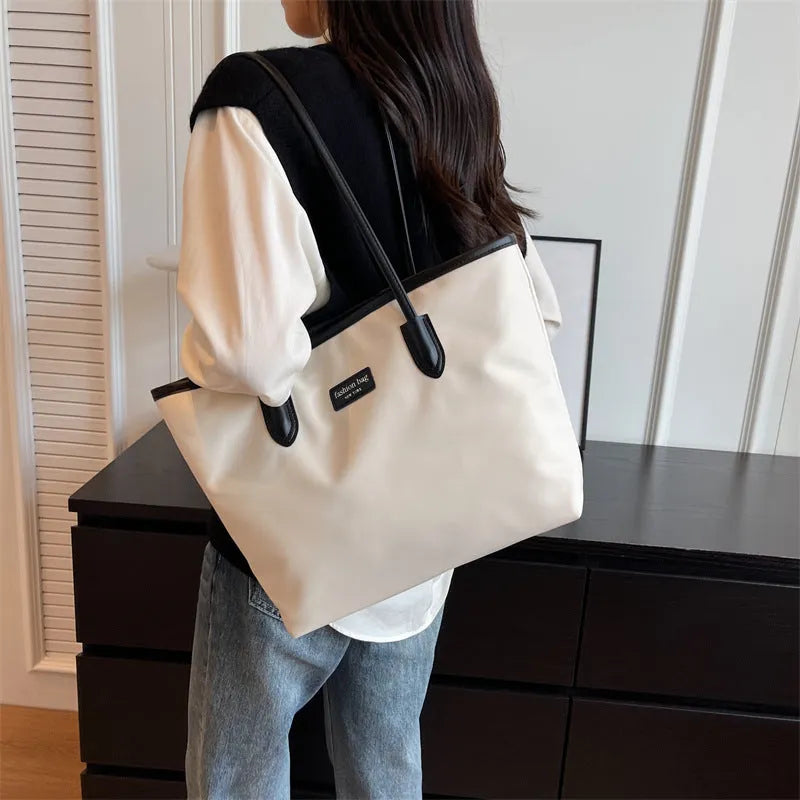 Large capacity women's shoulder bag in black oxford cloth with double straps and hidden pocket, vertical square shape