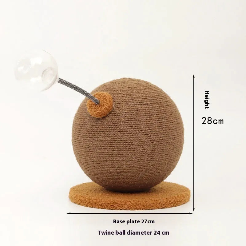 A hemp rope cat scratching board with a colourful cat grasping ball toy placed beside it.