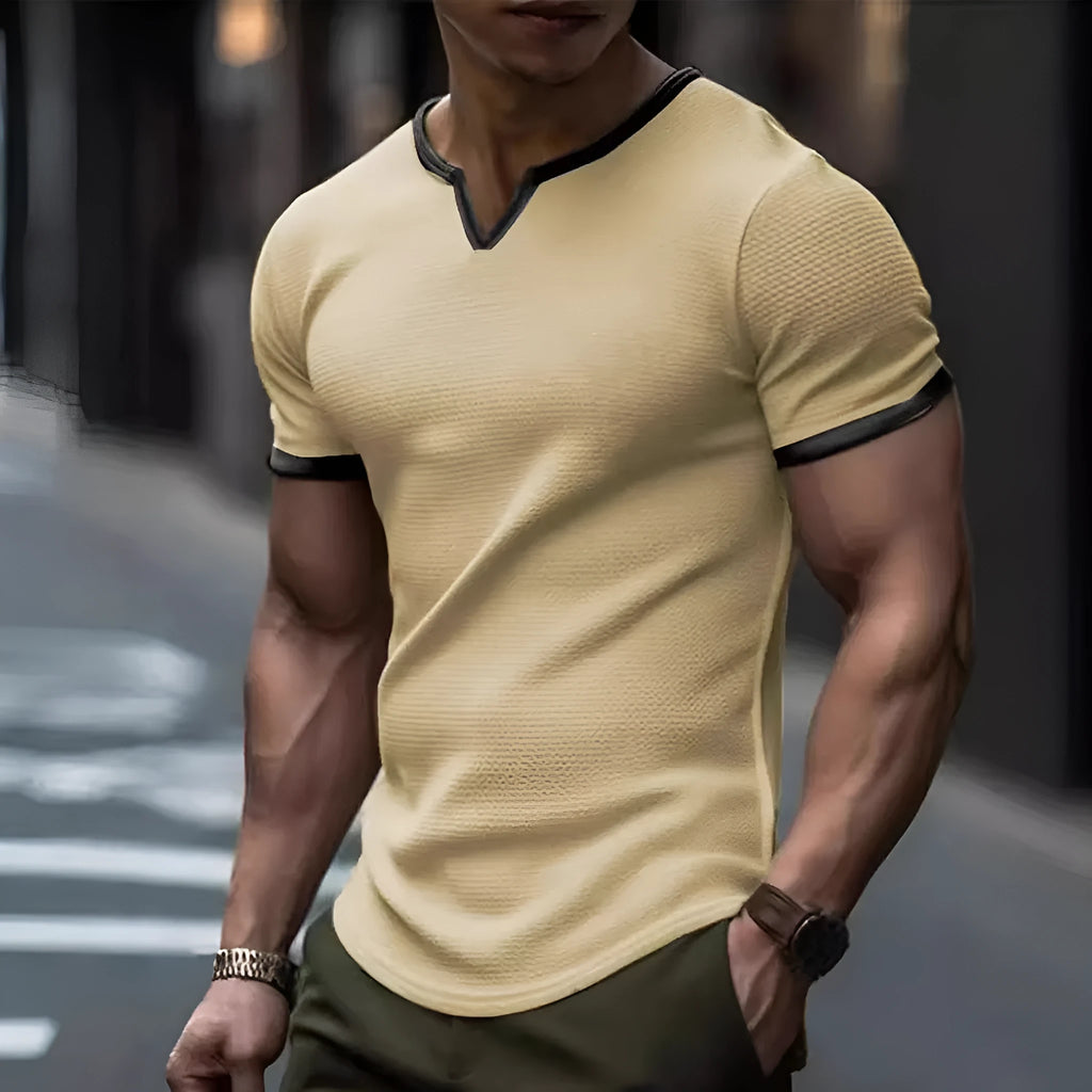 Men's colour-block V-neck short-sleeve sports T-shirt on a hanger, showing waffle texture and multiple colour options.