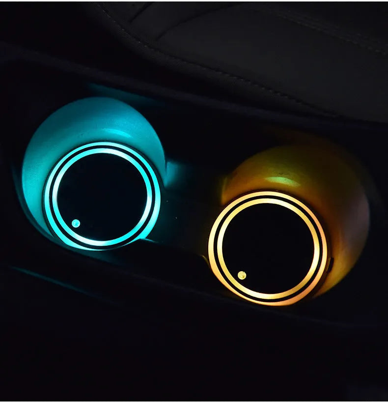 Colourful LED light-up coaster for car cup holder with solar panel and USB cable.