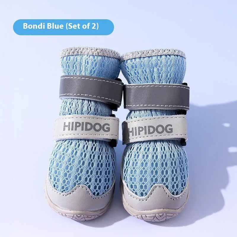 Cartoon-style blue and green dog shoes made from PU material for summer paw protection.