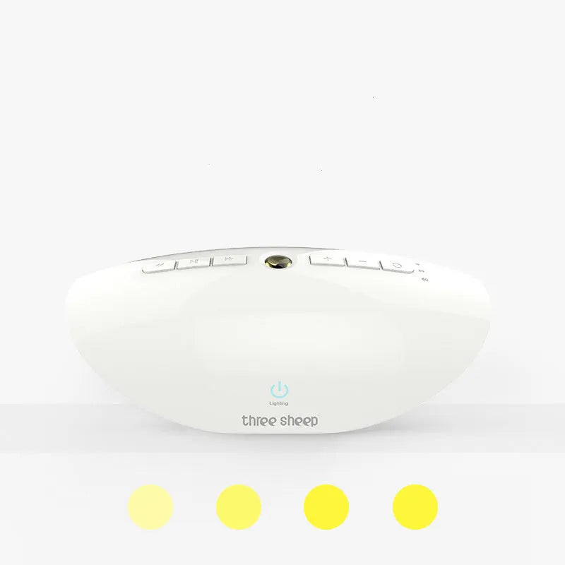 White rechargeable sleep sound machine with mechanical buttons on a white background