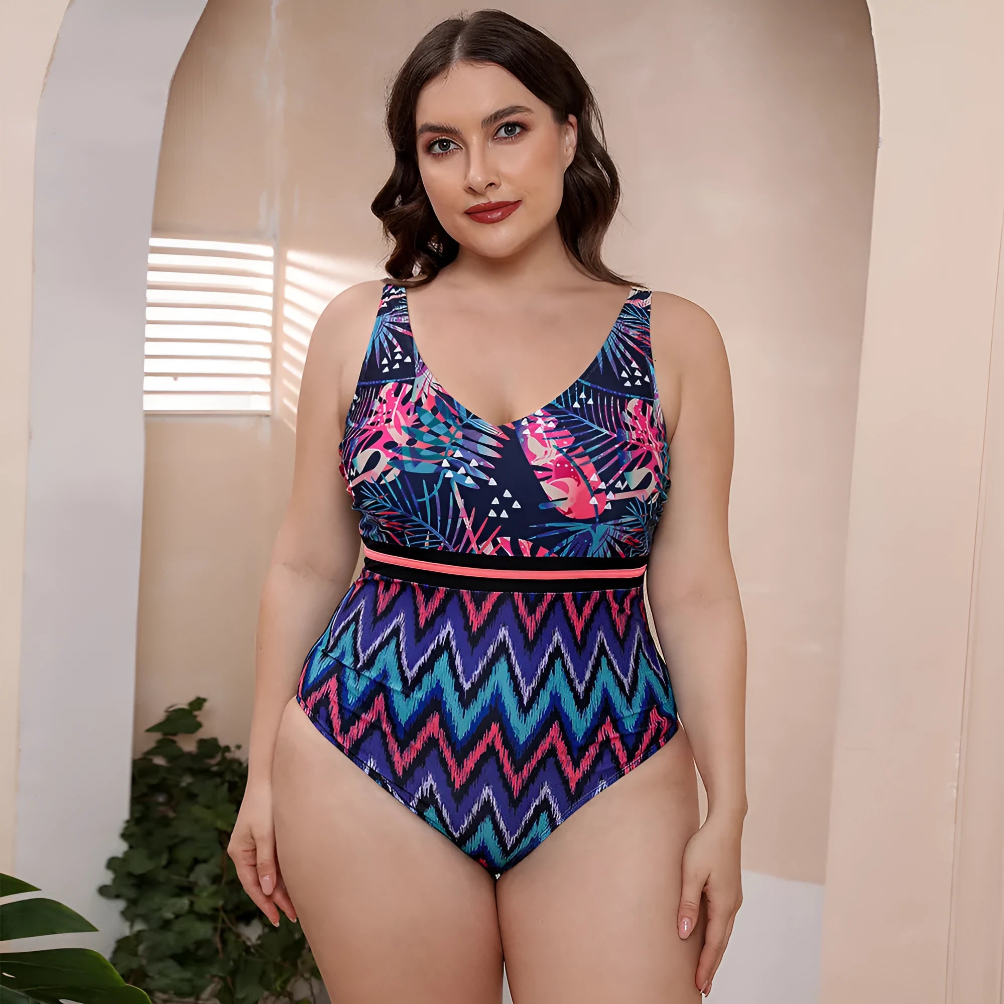 Women's blue printed one-piece swimsuit with spaghetti straps and a striped vest design.