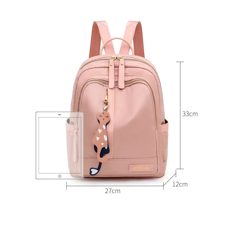 Black nylon casual backpack with external pockets, shown with adjustable straps and a soft handle.