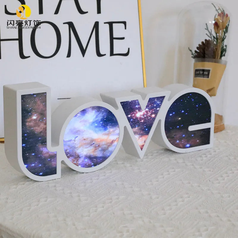 Rainbow LED LOVE decorative light with plastic shell measuring 35.5cm by 13.5cm