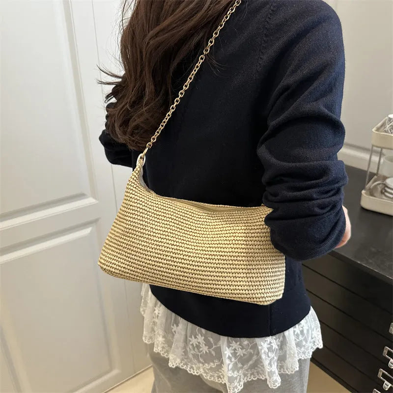 Woven straw shoulder tote bag in khaki colour with sandwich pocket design and internal phone compartment