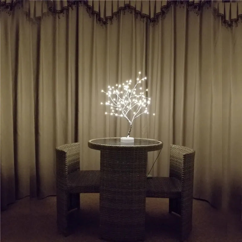 Tree light night light with bonsai-style design, warm white LED lights, adjustable branches, and USB plug.
