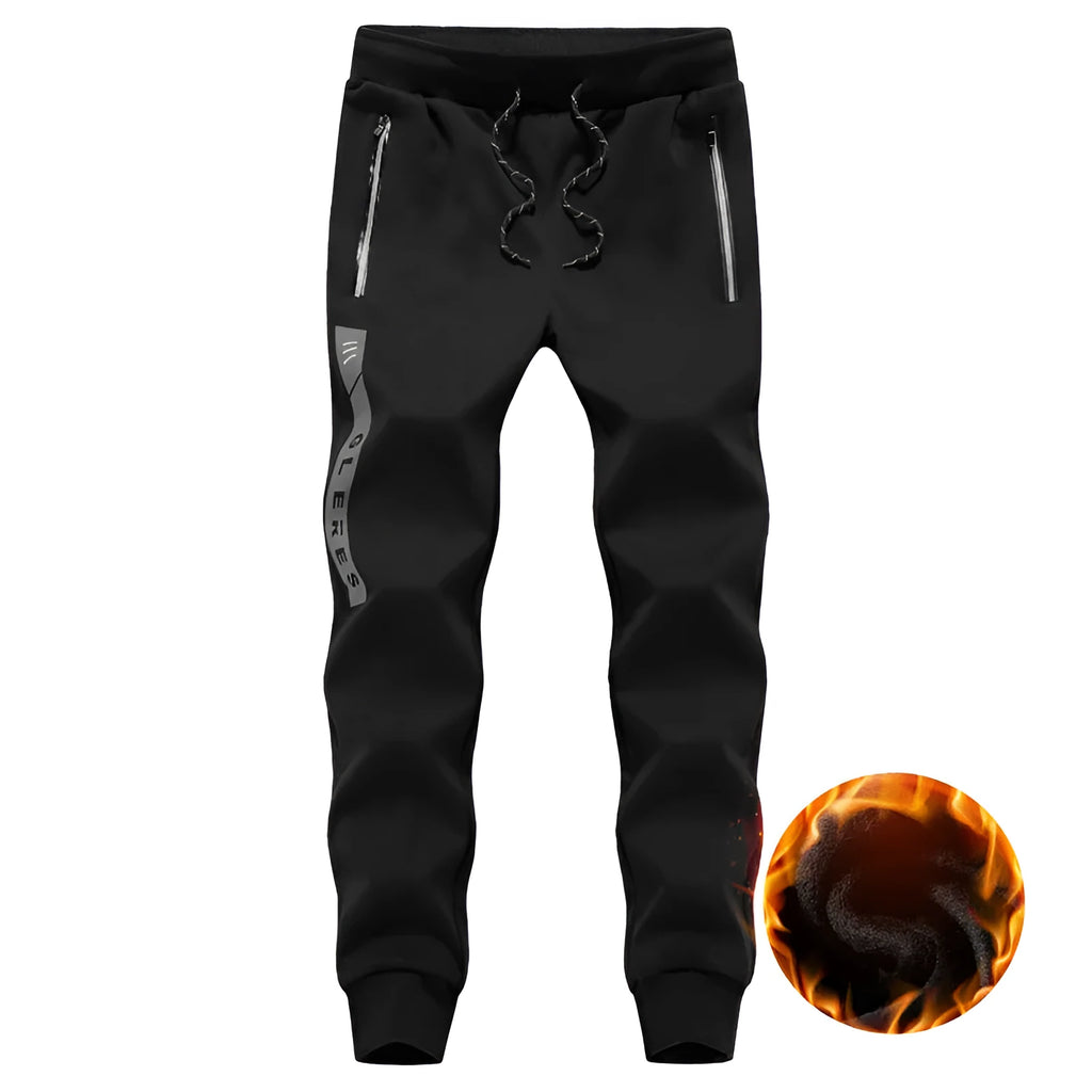 Men's sports casual harem pants in black, side view, with elastic waist and relaxed fit.