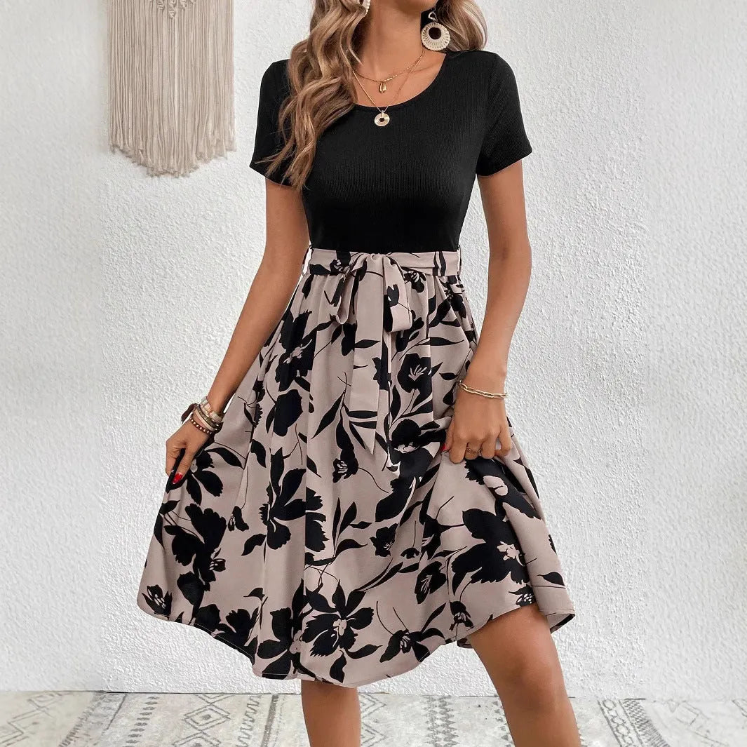 Women's khaki casual dress with plant print, A-line skirt, lace-up detail, and regular sleeves.