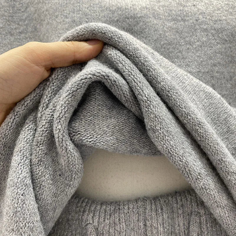 Women's loose-fitting long sleeve sweater and knitted wide leg shorts two-piece set in oatmeal colour.