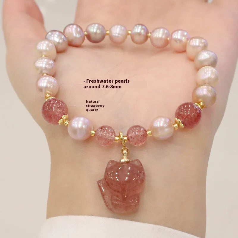 Women's light pink freshwater pearl bracelet with fox charm and strawberry quartz stones