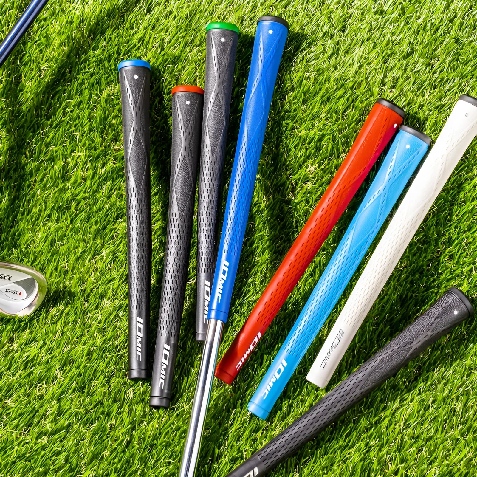 TPE golf club grip in assorted colours including pink, red, blue, white, and two-tone black combinations.