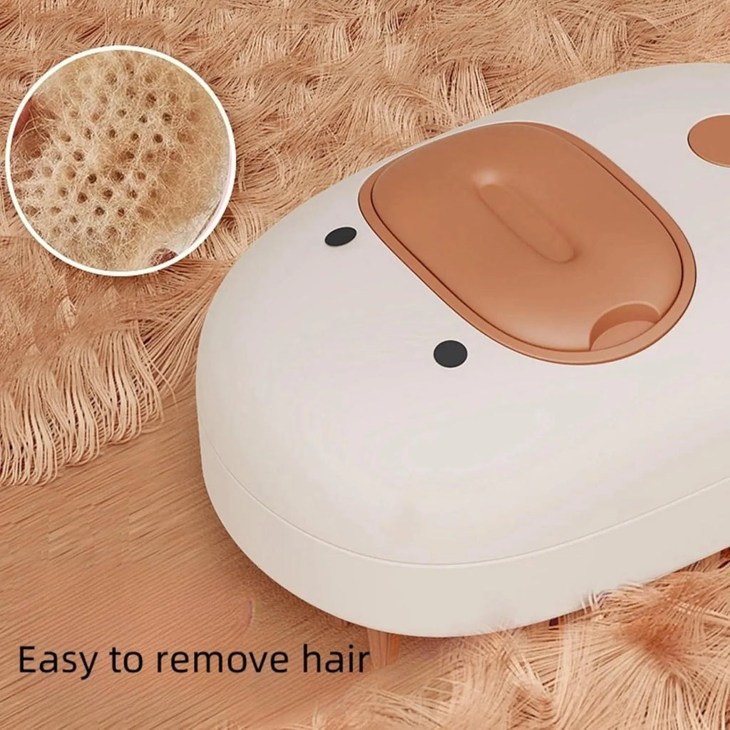White rechargeable silicone steam brush for grooming dogs and cats on a table.