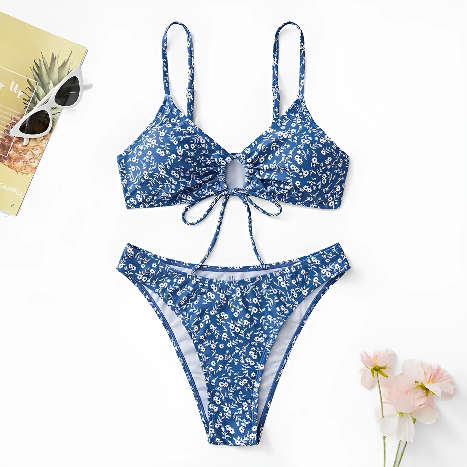 Blue polyester three-piece swimsuit set comprising a rash vest and matching shorts.