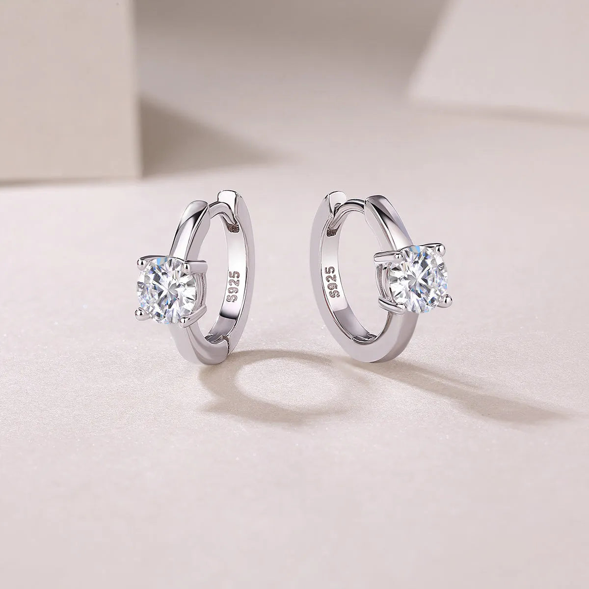 0.5-carat top-quality moissanite stud earrings in S925 silver with platinum plating on white background