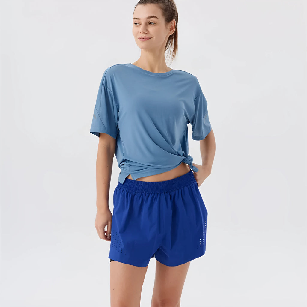 Men's turmeric yellow sports shorts with side slits, made from micro-elastic nylon fabric.