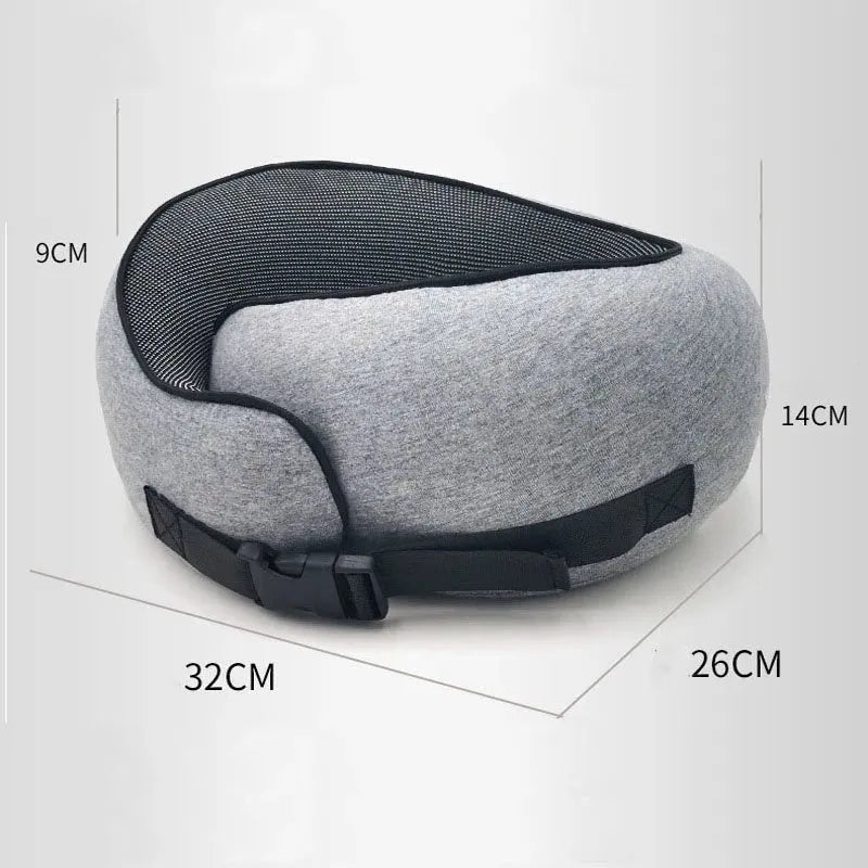 Navy blue U-shaped travel neck pillow with memory foam filling shown rolled for compact storage