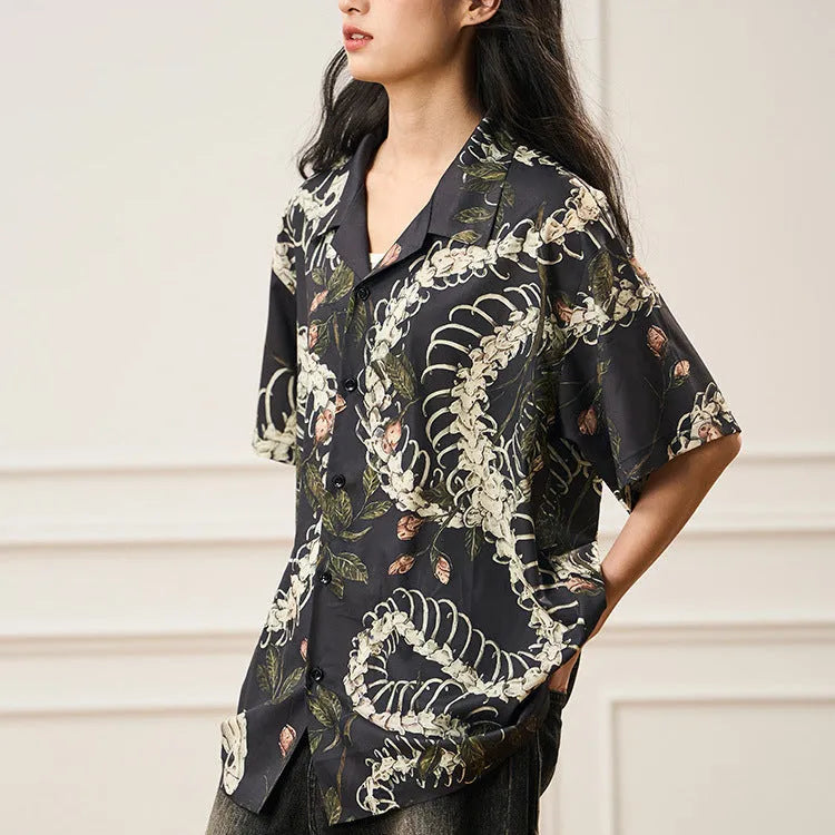 Short sleeve Cuban collar shirt featuring a printed snake bone and flower pattern in a loose fit.