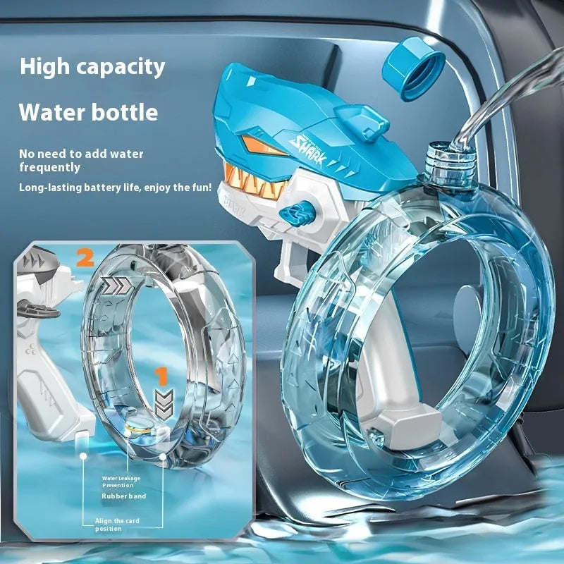Blue Shark-shaped electric water gun toy with large tank on a summer beach.